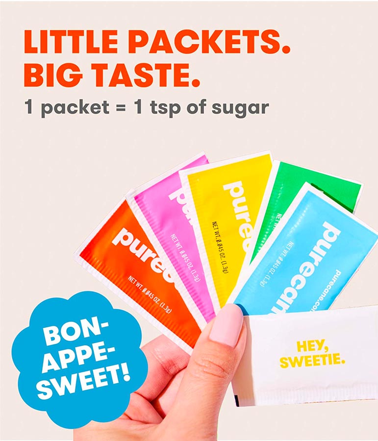 Hand Holding Purecane Sweetener Packets. 1 Packet = 1 Teaspoon of Sugar.